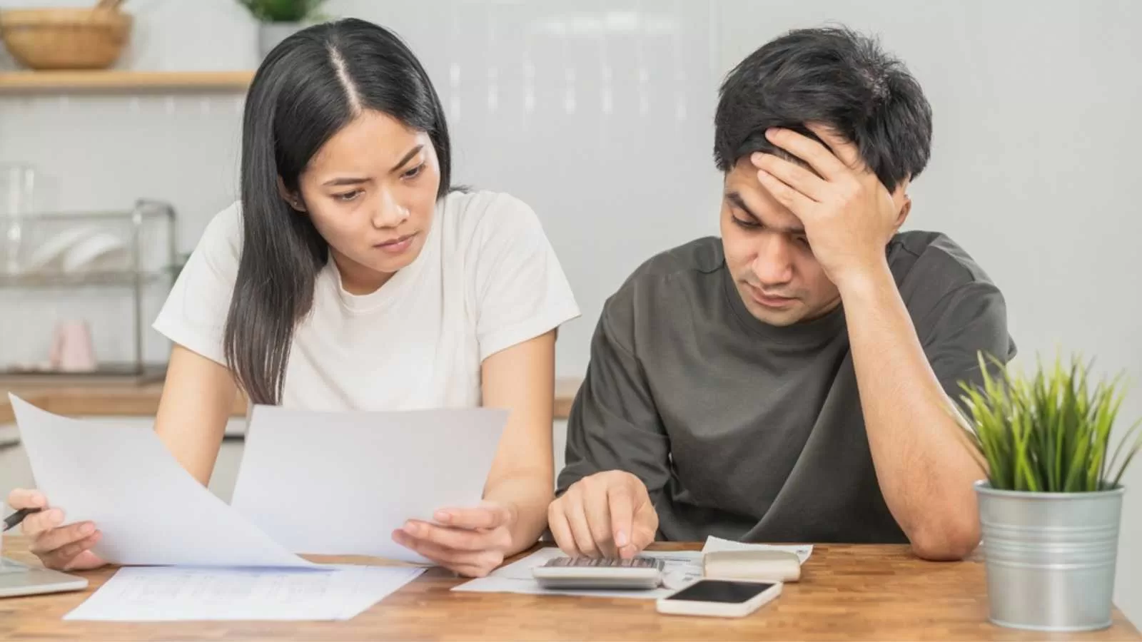 Couples stressed calculating expenses