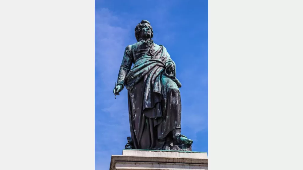 The statue of W.A.Mozart in the Mozart Square in Salzburg with deep blue sky-Austria,Europe